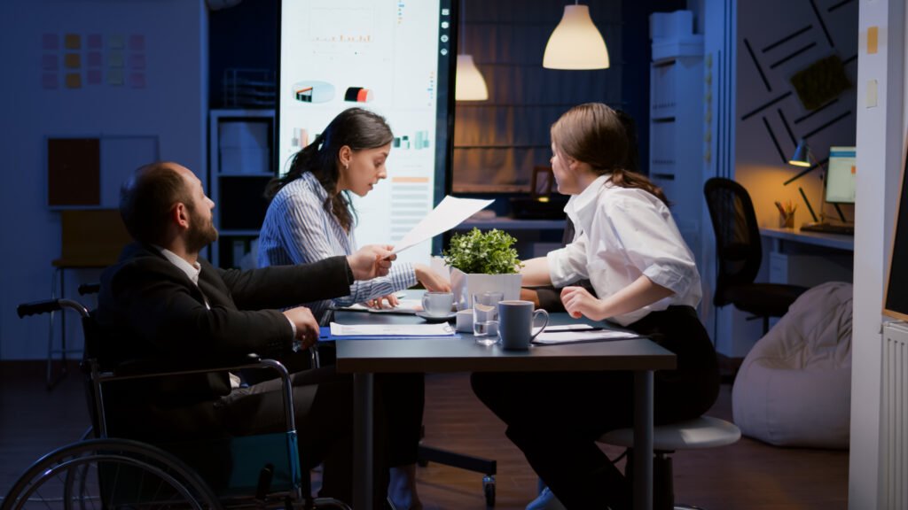 Three diverse colleagues engaged i